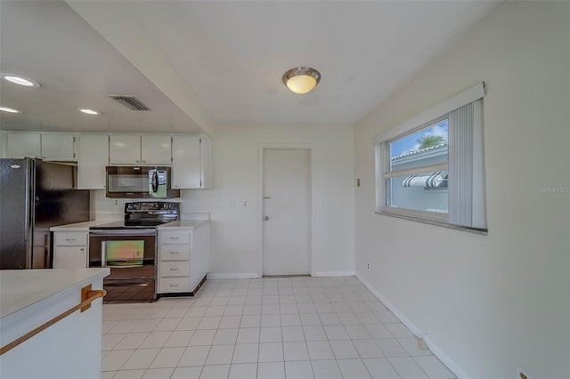 10005 41st St N, Pinellas Park, FL 33782 - kitchen with black appliances, light countertops, baseboards, white cabinetry, and recessed lighting