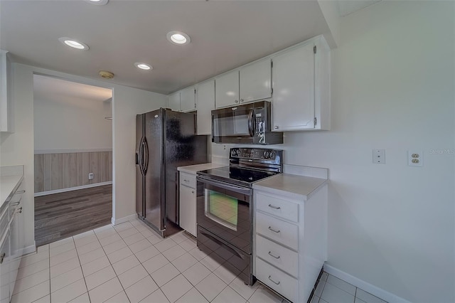 10005 41st St N, Pinellas Park, FL 33782 - kitchen featuring black appliances, baseboards, light countertops, and recessed lighting