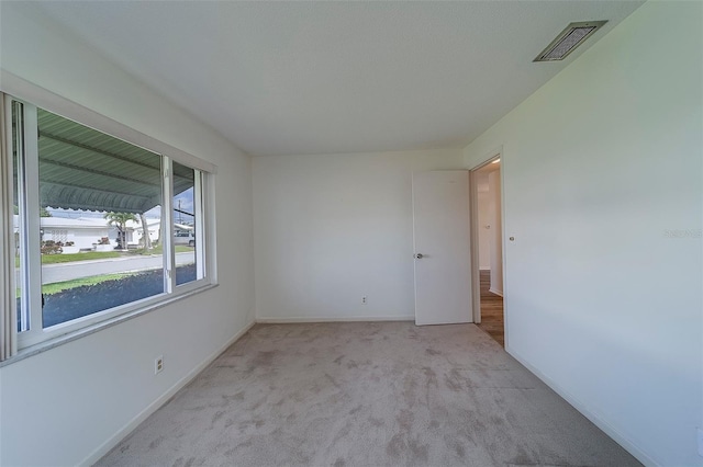 10005 41st St N, Pinellas Park, FL 33782 - carpeted empty room featuring baseboards