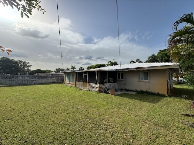 2160 NE 53rd St, Fort Lauderdale, FL 33308 - back of house featuring a sunroom and stucco siding