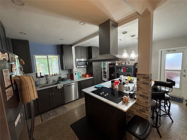 2160 NE 53rd St, Fort Lauderdale, FL 33308 - kitchen with black appliances, island exhaust hood, light aggregate flooring, decorative backsplash, and a kitchen breakfast bar