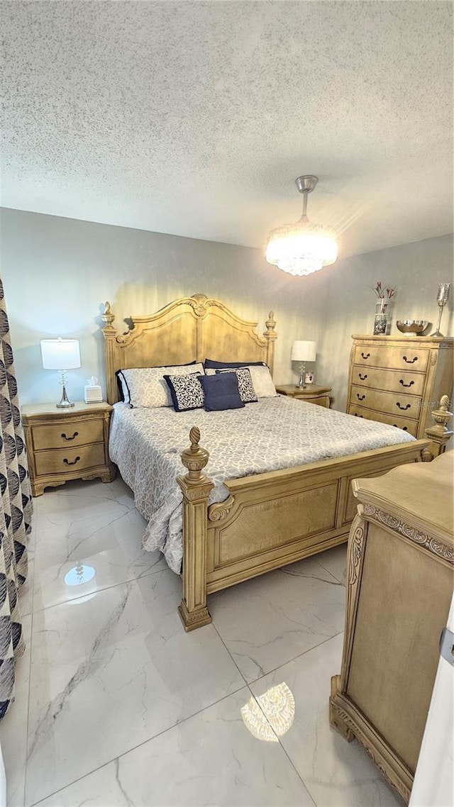 6424 Thicket Trl, New Port Richey, FL 34653 - bedroom featuring light marble finish flooring and a textured ceiling