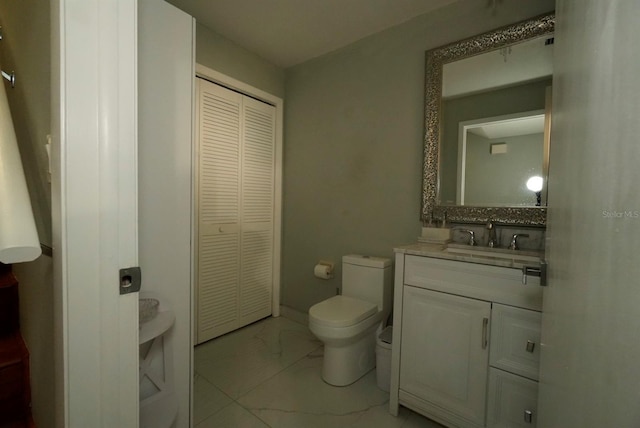6424 Thicket Trl, New Port Richey, FL 34653 - bathroom with marble finish floors, a closet, toilet, and vanity