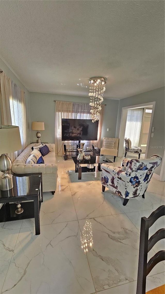 6424 Thicket Trl, New Port Richey, FL 34653 - living room with a textured ceiling, marble finish flooring, healthy amount of natural light, and a chandelier
