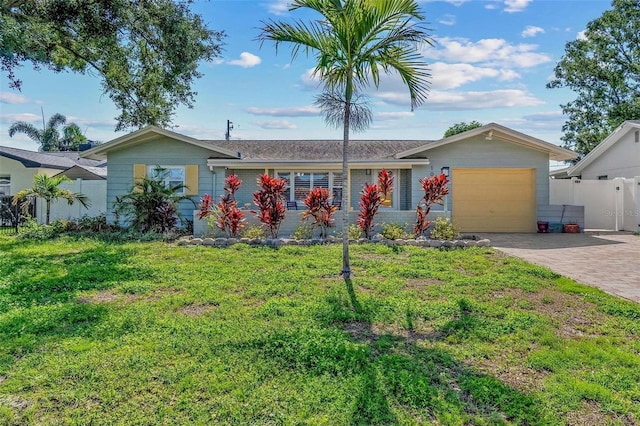 10339 111th St, Largo, FL 33778 - ranch-style house featuring an attached garage and driveway