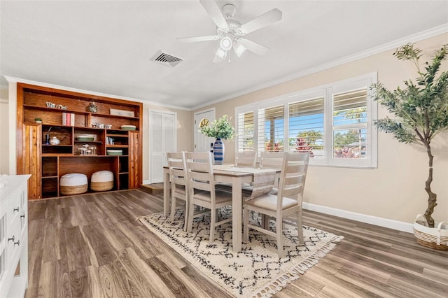 10339 111th St, Largo, FL 33778 - dining space with crown molding, wood finished floors, and ceiling fan