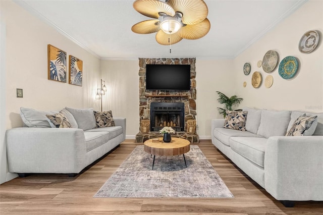 10339 111th St, Largo, FL 33778 - living room with a ceiling fan, crown molding, a fireplace, and wood finished floors