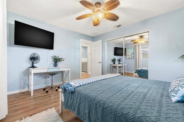10339 111th St, Largo, FL 33778 - bedroom with wood finished floors, ceiling fan, and a closet