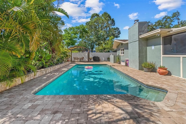 10339 111th St, Largo, FL 33778 - view of swimming pool featuring a fenced backyard, a patio area, and a gazebo