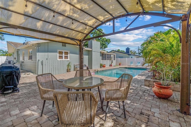 10339 111th St, Largo, FL 33778 - view of pool featuring a patio, a fenced backyard, and a grill