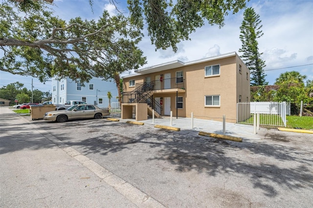 1771 Russell St S, Saint Petersburg, FL 33712 - view of building exterior featuring uncovered parking and stairs