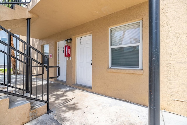 1771 Russell St S, Saint Petersburg, FL 33712 - doorway to property featuring stucco siding