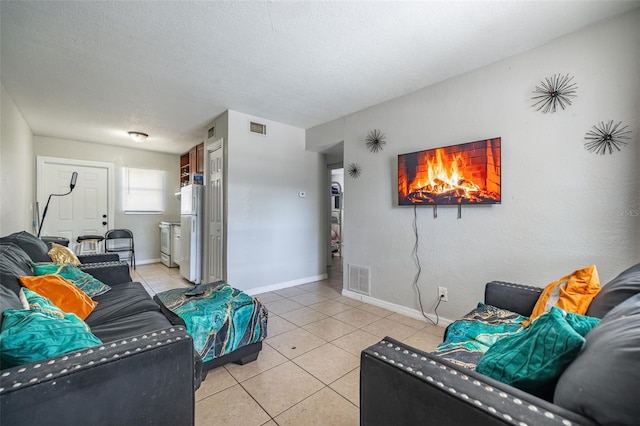 1771 Russell St S, Saint Petersburg, FL 33712 - living room featuring light tile patterned floors and baseboards
