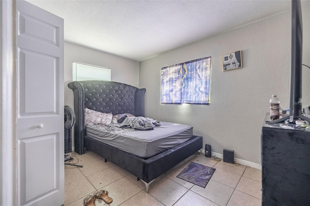 1771 Russell St S, Saint Petersburg, FL 33712 - bedroom featuring tile patterned floors and a textured wall