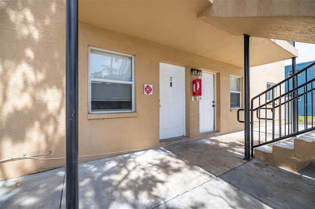 1771 Russell St S, Saint Petersburg, FL 33712 - doorway to property with stucco siding