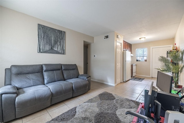 1771 Russell St S, Saint Petersburg, FL 33712 - living room with light tile patterned floors and baseboards