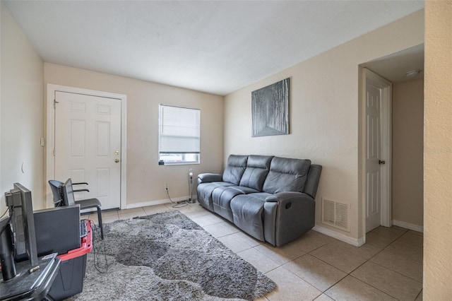 1771 Russell St S, Saint Petersburg, FL 33712 - living area with tile patterned floors and baseboards