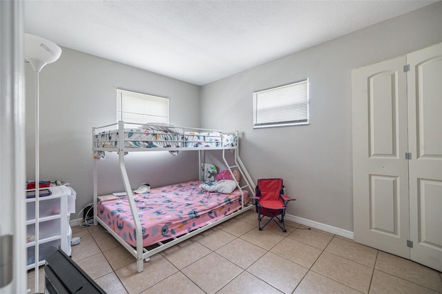 1771 Russell St S, Saint Petersburg, FL 33712 - bedroom with light tile patterned flooring and baseboards