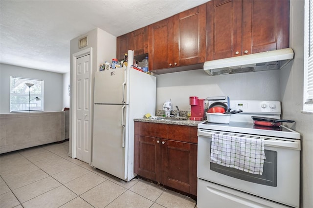 1771 Russell St S, Saint Petersburg, FL 33712 - kitchen featuring white appliances, under cabinet range hood, light tile patterned flooring, and light stone counters