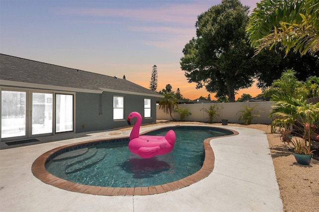 3905 31st Ave W, Bradenton, FL 34205 - pool at dusk with a fenced backyard and a patio area
