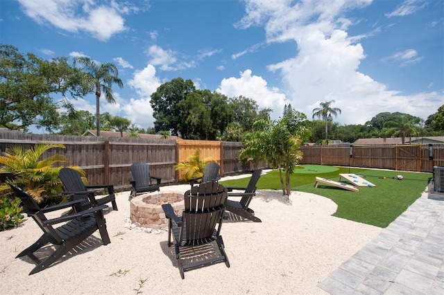 3905 31st Ave W, Bradenton, FL 34205 - fenced backyard with an outdoor fire pit and a patio