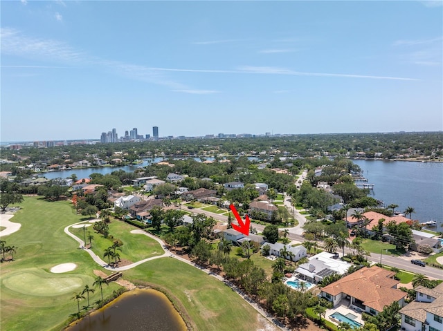 167 Almedo Way NE, Saint Petersburg, FL 33704 - aerial view of residential area with a large body of water, a local golf course, and city skyline