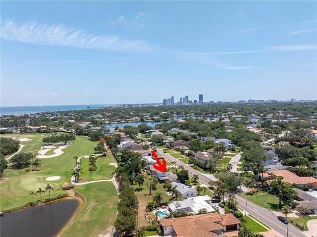 167 Almedo Way NE, Saint Petersburg, FL 33704 - aerial view of residential area featuring a large body of water, a local golf course, and city skyline