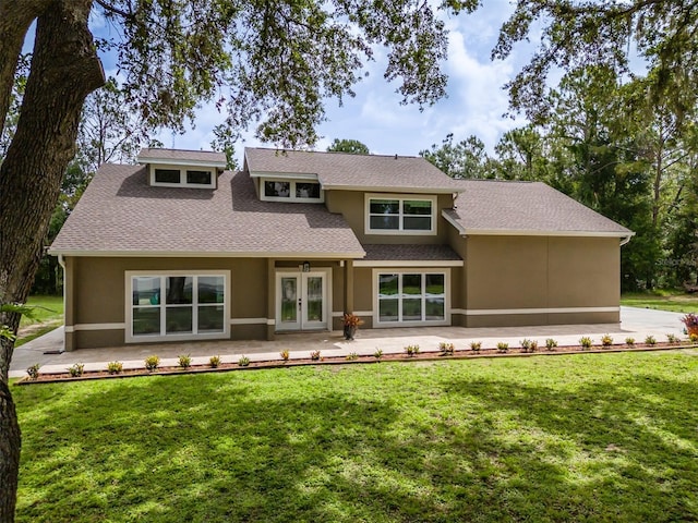 4044 Red Fox Ct, Wesley Chapel, FL 33543 - rear view of house featuring french doors, stucco siding, and a yard