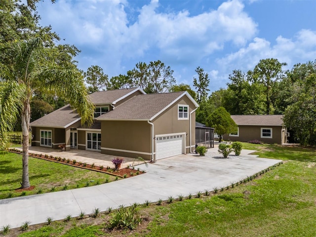 4044 Red Fox Ct, Wesley Chapel, FL 33543 - view of front of home featuring driveway, stucco siding, a front yard, and glass enclosure