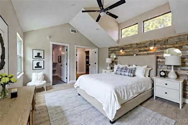 4044 Red Fox Ct, Wesley Chapel, FL 33543 - bedroom featuring vaulted ceiling, wood finished floors, a ceiling fan, and connected bathroom