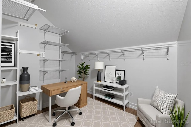 4044 Red Fox Ct, Wesley Chapel, FL 33543 - office space featuring vaulted ceiling, wood finished floors, and baseboards