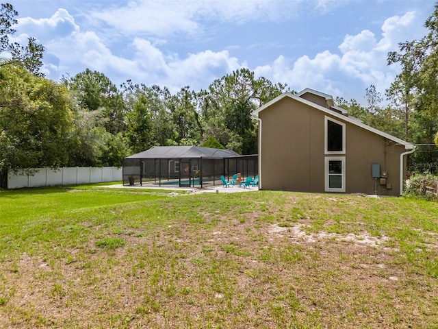 4044 Red Fox Ct, Wesley Chapel, FL 33543 - view of yard featuring glass enclosure, a patio, and view of scattered trees