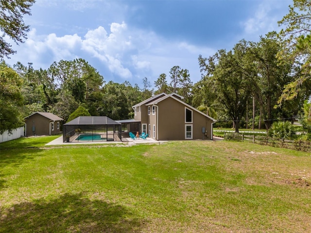 4044 Red Fox Ct, Wesley Chapel, FL 33543 - rear view of house featuring a detached carport, an outdoor pool, a patio, a lanai, and view of wooded area