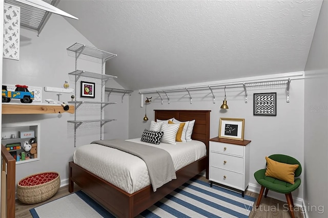 4044 Red Fox Ct, Wesley Chapel, FL 33543 - bedroom with wood finished floors, lofted ceiling, and baseboards