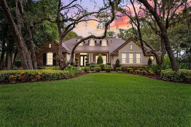 17802 Mission Oak Dr, Lithia, FL 33547 - view of front of home with stucco siding and a lawn