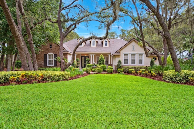 17802 Mission Oak Dr, Lithia, FL 33547 - view of front of property with stucco siding and a front yard