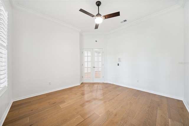 17802 Mission Oak Dr, Lithia, FL 33547 - empty room featuring light wood-style flooring, a ceiling fan, ornamental molding, and baseboards