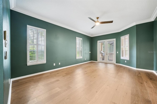 17802 Mission Oak Dr, Lithia, FL 33547 - empty room featuring ceiling fan, ornamental molding, wood finished floors, baseboards, and french doors