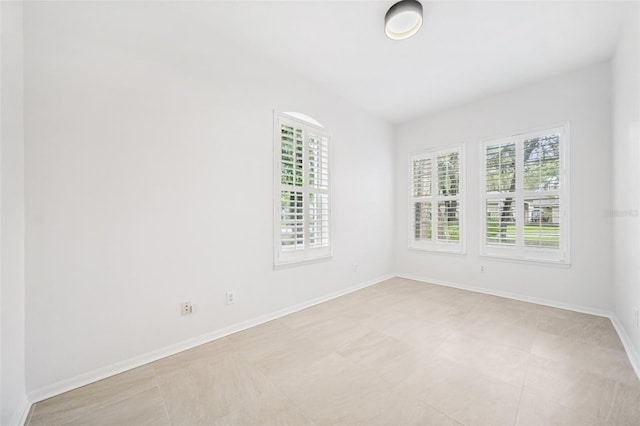 17802 Mission Oak Dr, Lithia, FL 33547 - spare room featuring light tile patterned floors and baseboards