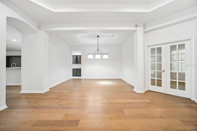 17802 Mission Oak Dr, Lithia, FL 33547 - unfurnished dining area with light wood finished floors, french doors, baseboards, and ornamental molding