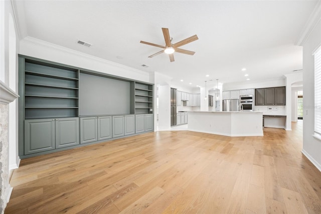 17802 Mission Oak Dr, Lithia, FL 33547 - unfurnished living room featuring ceiling fan, ornamental molding, light wood-type flooring, and recessed lighting