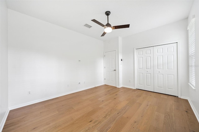 17802 Mission Oak Dr, Lithia, FL 33547 - unfurnished bedroom featuring light wood-style floors, baseboards, a closet, and ceiling fan