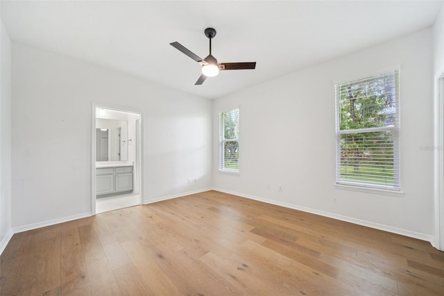 17802 Mission Oak Dr, Lithia, FL 33547 - unfurnished room featuring light wood-type flooring, ceiling fan, and baseboards