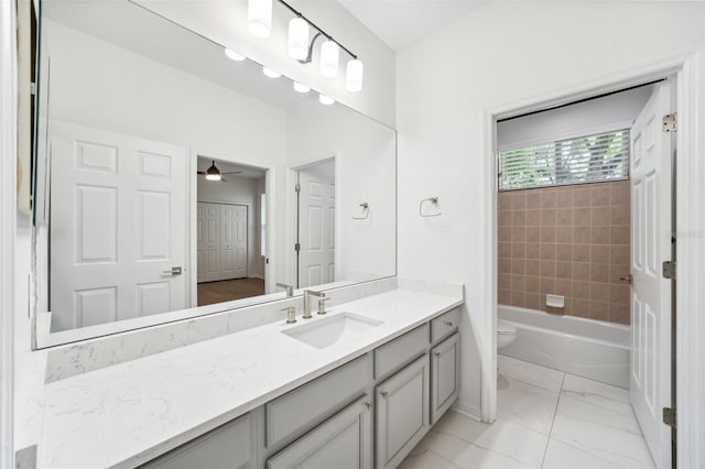 17802 Mission Oak Dr, Lithia, FL 33547 - full bath featuring vanity, toilet, ceiling fan, and marble finish flooring