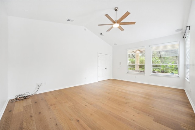 17802 Mission Oak Dr, Lithia, FL 33547 - empty room featuring ceiling fan, light wood-style floors, baseboards, and high vaulted ceiling