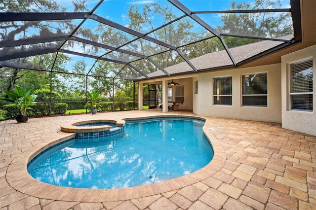 17802 Mission Oak Dr, Lithia, FL 33547 - view of pool with a patio area, a pool with connected hot tub, a ceiling fan, and glass enclosure