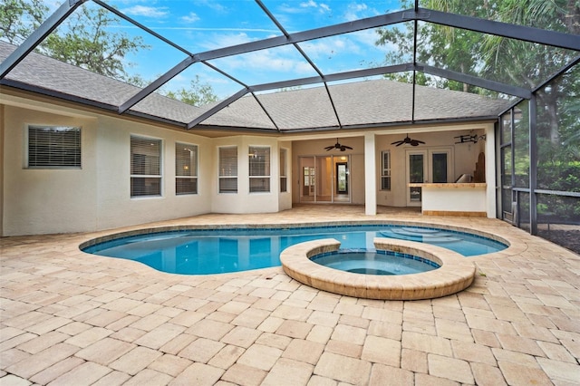 17802 Mission Oak Dr, Lithia, FL 33547 - view of pool featuring a ceiling fan, a patio area, a pool with connected hot tub, and a lanai
