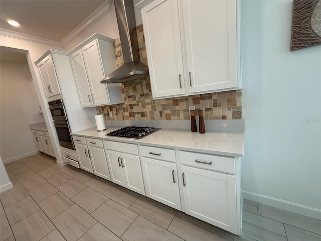 17304 Scuba Crest St, Wimauma, FL 33598 - kitchen with wall chimney exhaust hood, stainless steel gas stovetop, backsplash, double wall oven, and ornamental molding