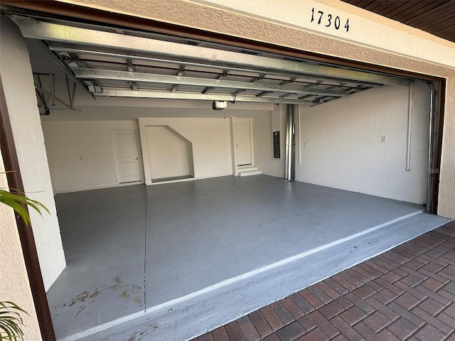 17304 Scuba Crest St, Wimauma, FL 33598 - garage with a garage door opener and electric panel