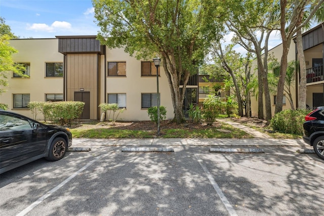 11809 Raintree Lake Ln Unit A, Tampa, FL 33617 - view of property with uncovered parking
